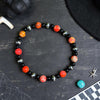 6" Black Onyx & Orange Sea Sediment Jasper Stretch Bracelet